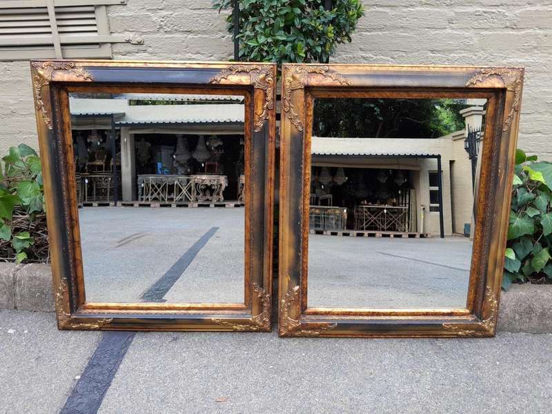 A 20TH Century Pair of Victorian Style Gilt Painted and Walnut Bevelled Mirrors