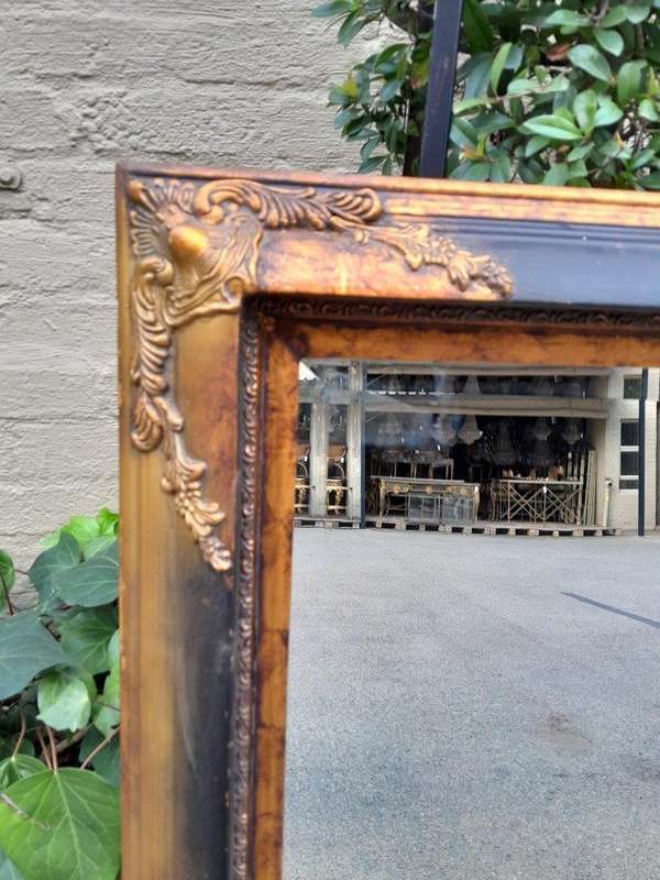 A 20TH Century Pair of Victorian Style Gilt Painted and Walnut Bevelled Mirrors