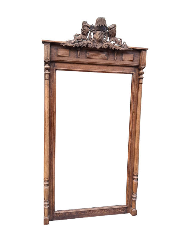 A 20th Century Oak Carved and Bevelled Mirror