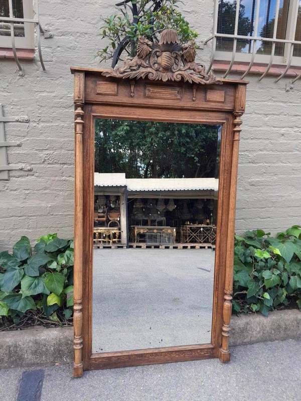 A 20th Century Oak Carved and Bevelled Mirror