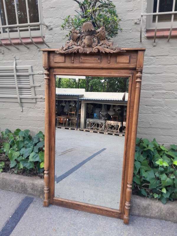A 20th Century Oak Carved and Bevelled Mirror