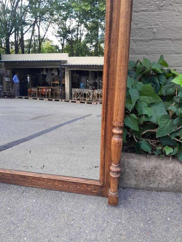 A 20th Century Oak Carved and Bevelled Mirror