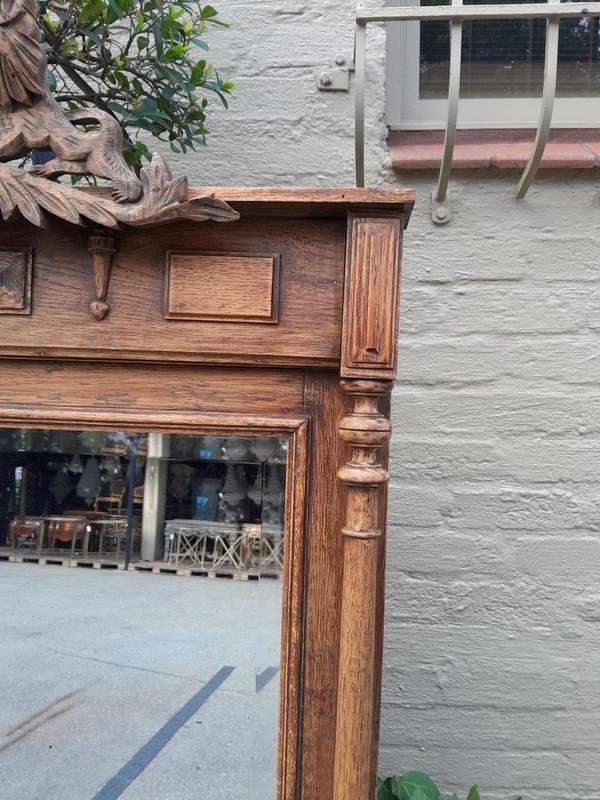 A 20th Century Oak Carved and Bevelled Mirror