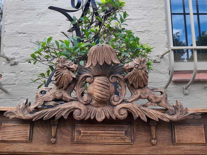 A 20th Century Oak Carved and Bevelled Mirror