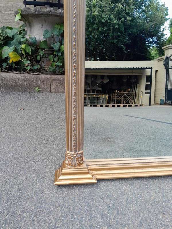 A 20th Century Rare Pair of French Louis XVI Style Gilt Painted Trumeau Bevelled Mirrors