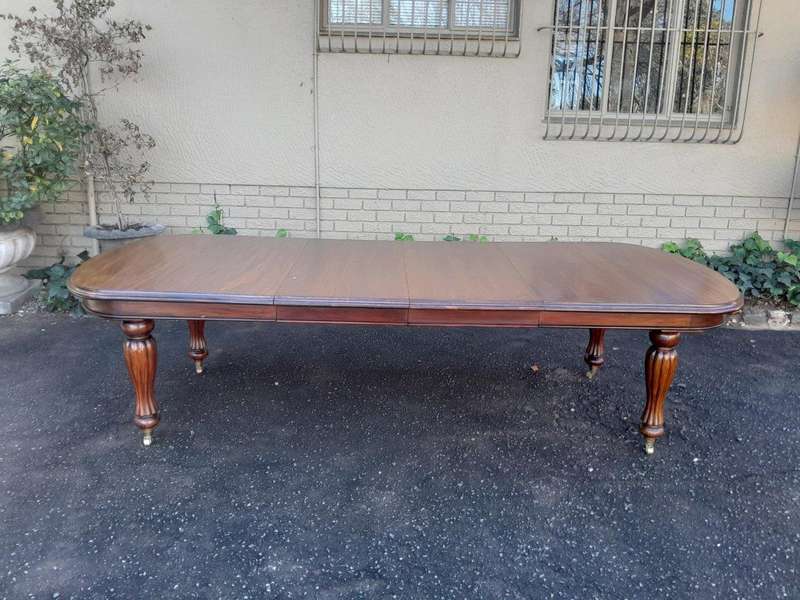 A Massive Antique Circa 1880 Victorian Carved Mahogany Dining Table With Two Extensions On Castor...