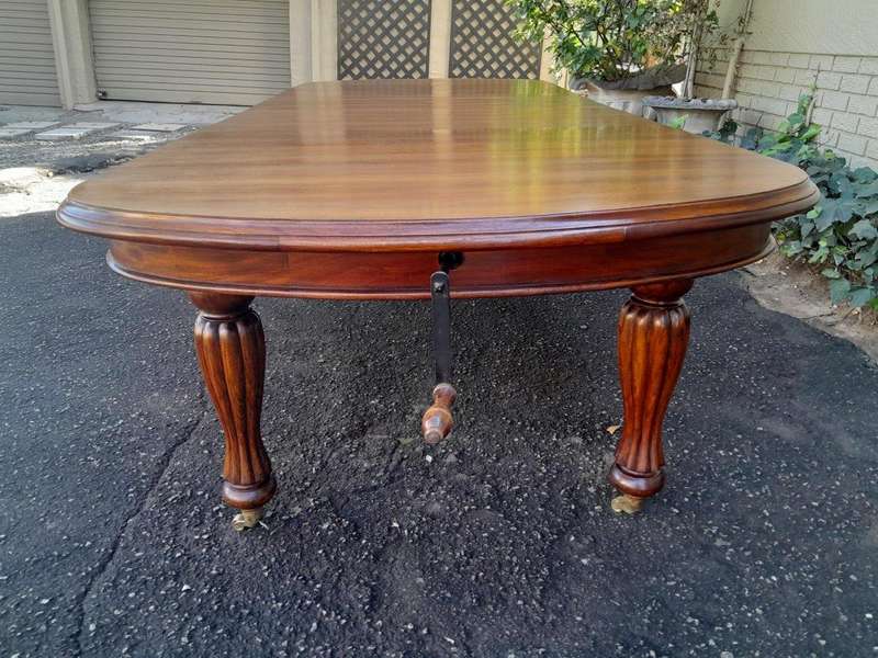 A Massive Antique Circa 1880 Victorian Carved Mahogany Dining Table With Two Extensions On Castor...