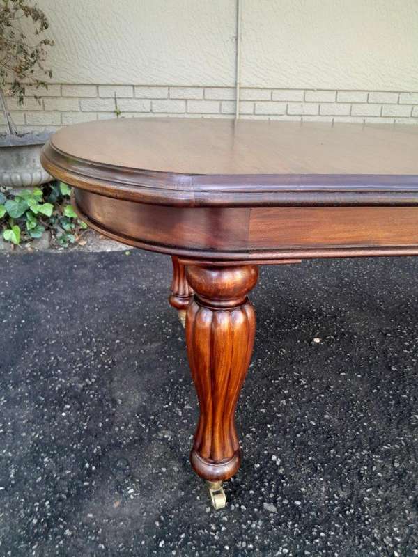 A Massive Antique Circa 1880 Victorian Carved Mahogany Dining Table With Two Extensions On Castor...