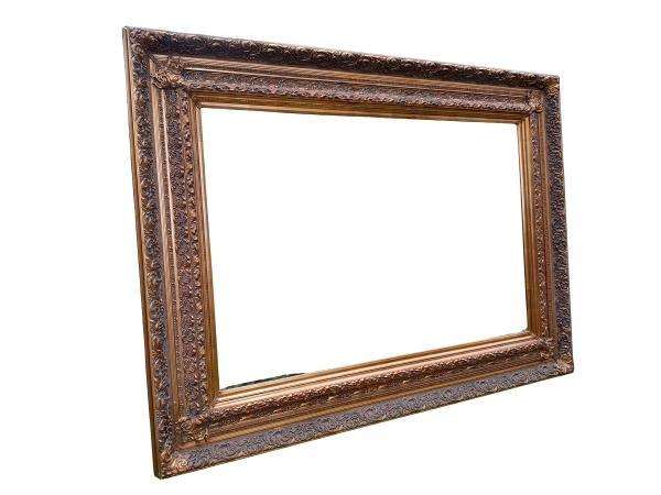 A 20th Century Heavily Carved And Bevelled Framed Mirror Of Large Proportions