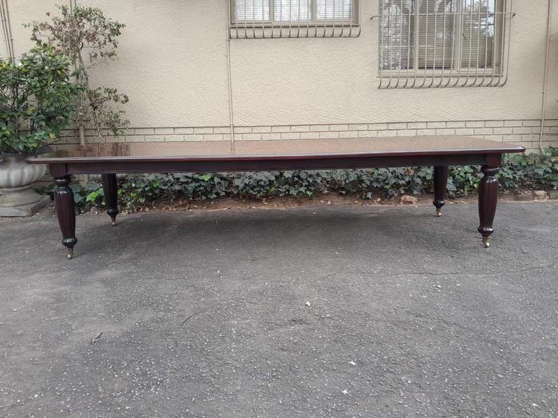 An Exceptional And Massive 20th Century Carved  Mahogany Dining Table On Large Brass Castors (14 ...