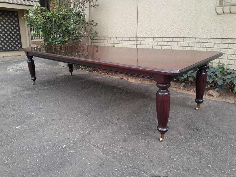 An Exceptional And Massive 20th Century Carved  Mahogany Dining Table On Large Brass Castors (14 ...