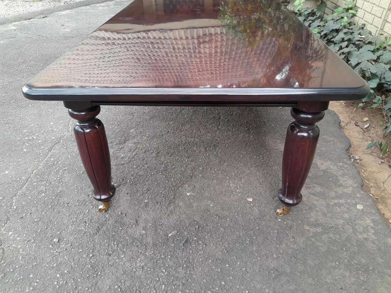 An Exceptional And Massive 20th Century Carved  Mahogany Dining Table On Large Brass Castors (14 ...