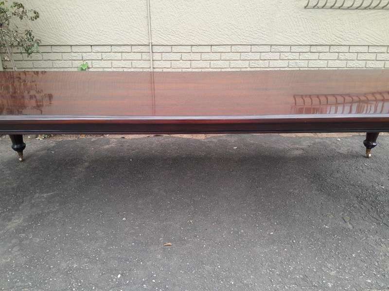 An Exceptional And Massive 20th Century Carved  Mahogany Dining Table On Large Brass Castors (14 ...