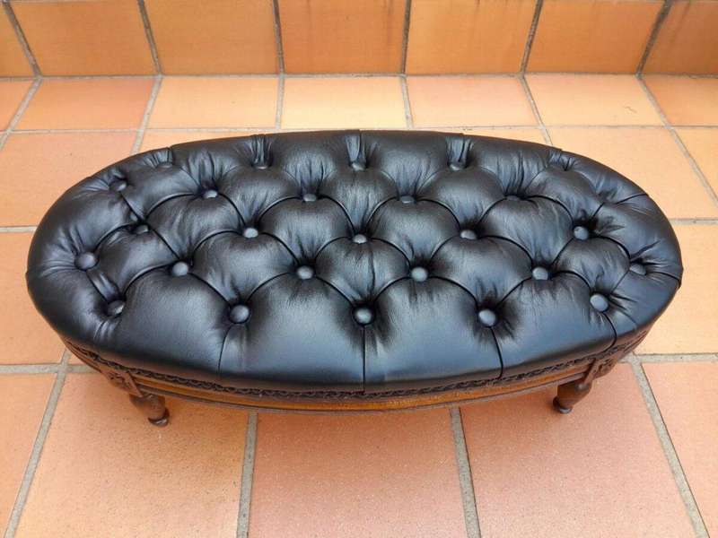 A 20th Century French Style Carved Beechwood Foot Stool Upholstered In Deep Buttoned Leather