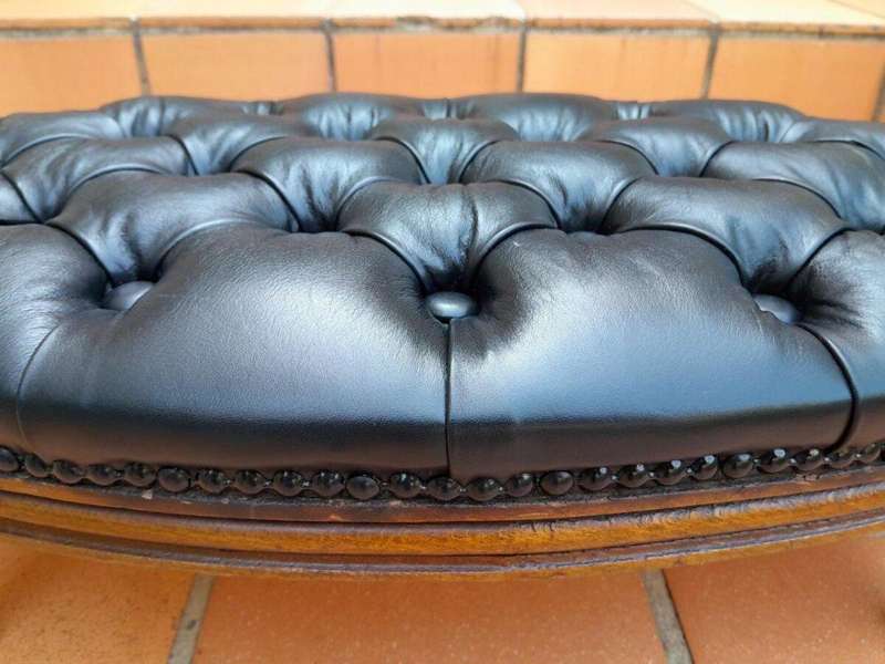 A 20th Century French Style Carved Beechwood Foot Stool Upholstered In Deep Buttoned Leather