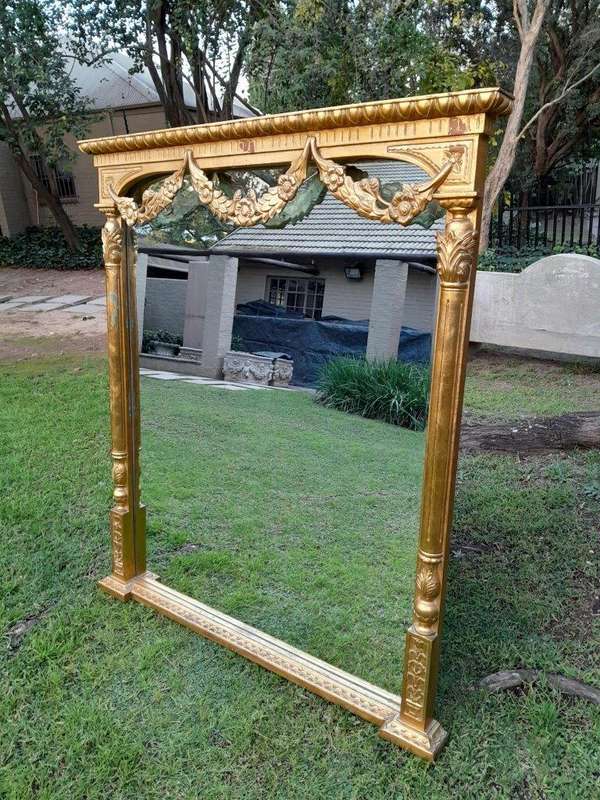 A 20th Century French Style Carved Giltwood Mirror Of Large Proportions