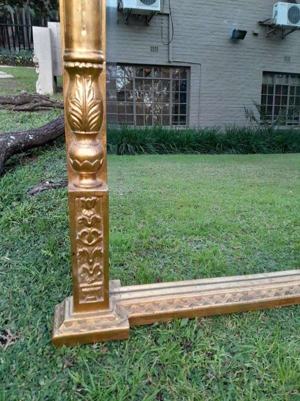 A 20th Century French Style Carved Giltwood Mirror Of Large Proportions