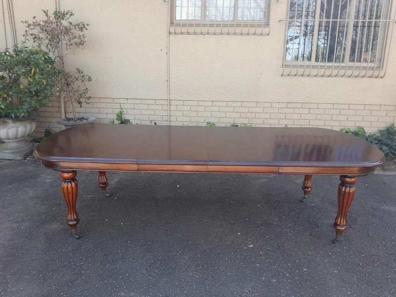 An Antique Victorian / Circa 1890s Dining Table With Two Leaves On Castors With A Crank Handle