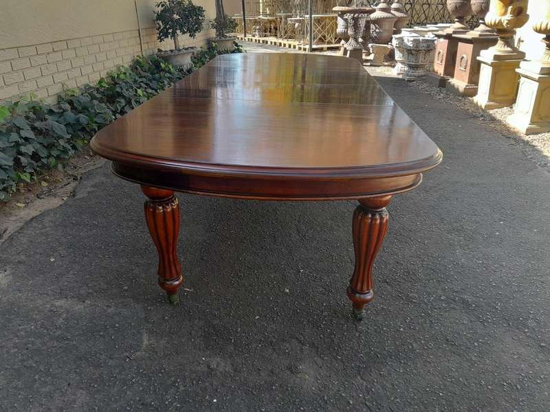 An Antique Victorian / Circa 1890s Dining Table With Two Leaves On Castors With A Crank Handle