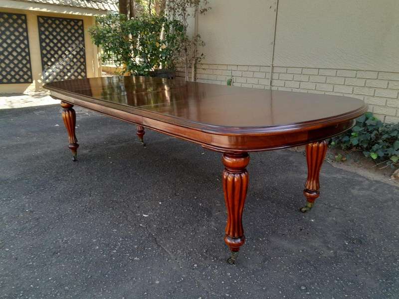 An Antique Victorian / Circa 1890s Dining Table With Two Leaves On Castors With A Crank Handle