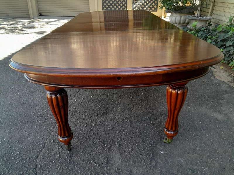An Antique Victorian / Circa 1890s Dining Table With Two Leaves On Castors With A Crank Handle