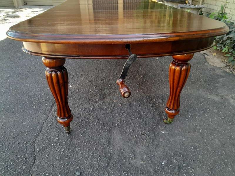 An Antique Victorian / Circa 1890s Dining Table With Two Leaves On Castors With A Crank Handle