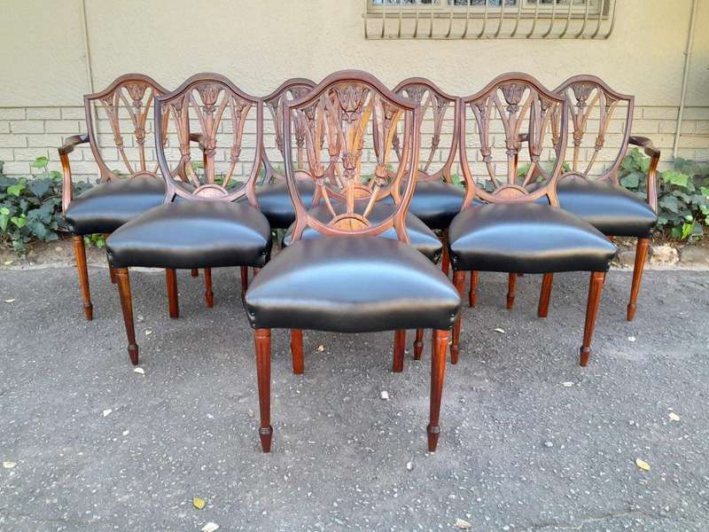 A 20th Century Set Of Eight Hepplewhite Style Dining Chairs With A Pair Of Armchairs / Carvers An...