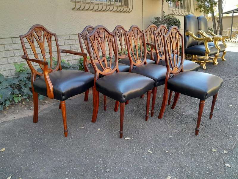A 20th Century Set Of Eight Hepplewhite Style Dining Chairs With A Pair Of Armchairs / Carvers An...