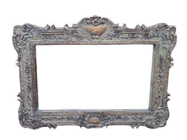 A 20th Century Victorian Style Heavily Carved Gilt And Green Mirror