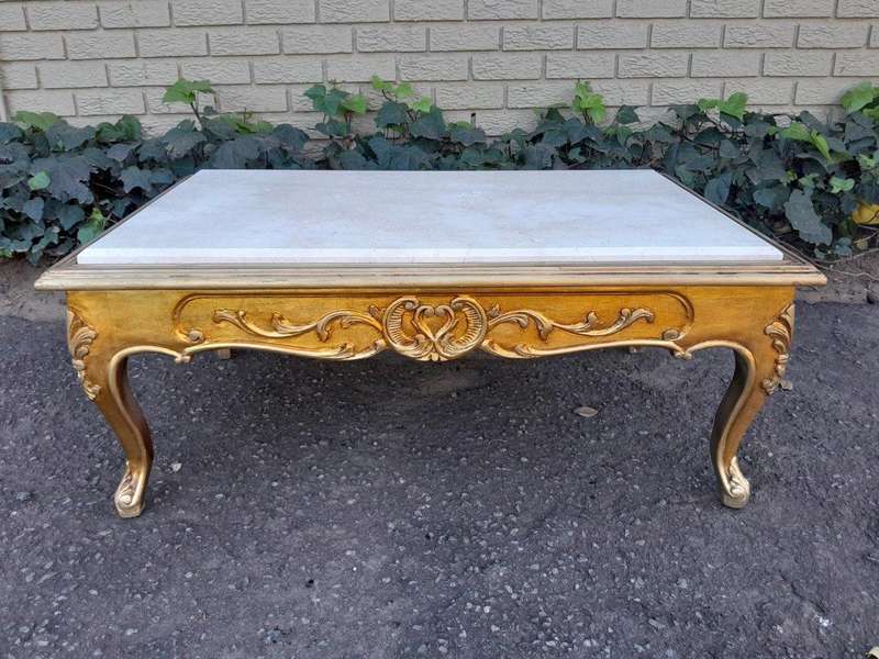 A 20th Century French Style Carved And Gilt Wood Coffee Table With Cream Marble Top