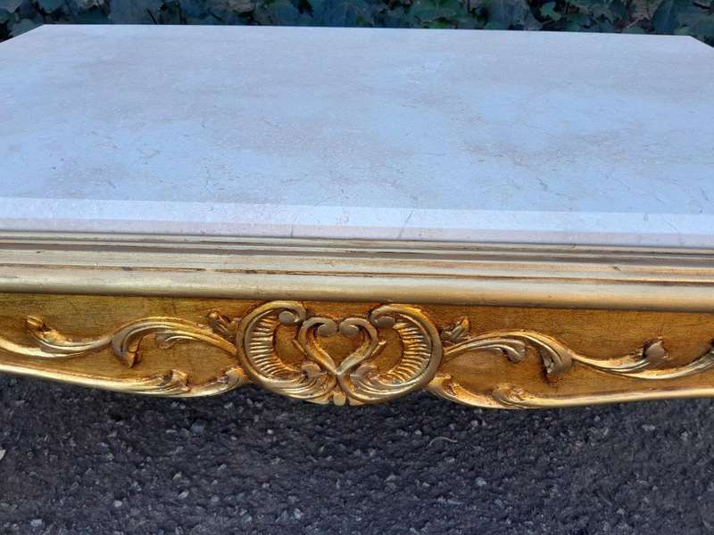 A 20th Century French Style Carved And Gilt Wood Coffee Table With Cream Marble Top