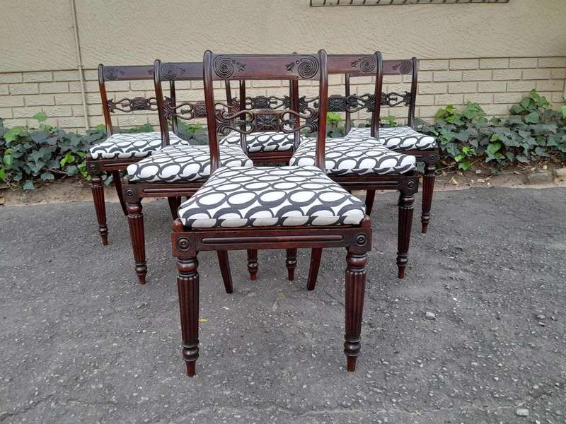An Antique Regency Carved Rosewood Set Of Chairs With Rattan Seats And Upholstered Designer Fabri...