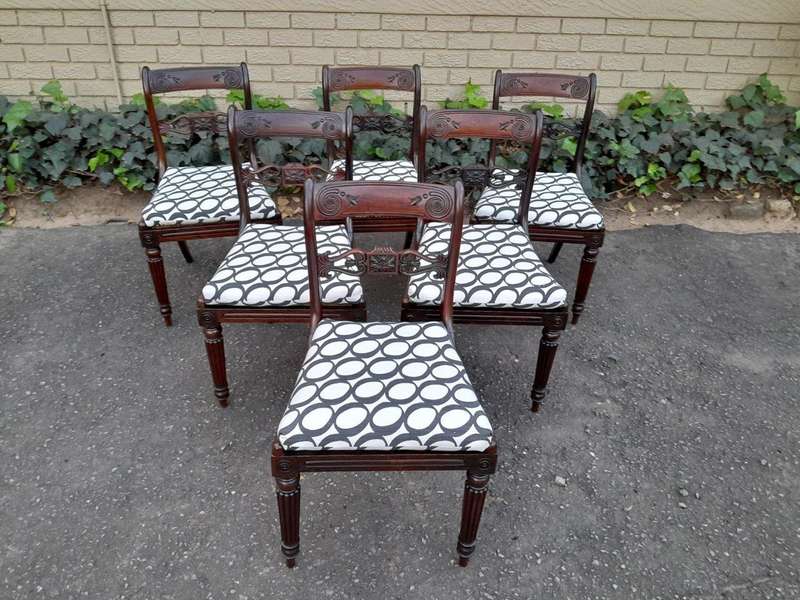 An Antique Regency Carved Rosewood Set Of Chairs With Rattan Seats And Upholstered Designer Fabri...