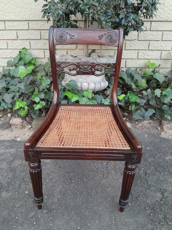 An Antique Regency Carved Rosewood Set Of Chairs With Rattan Seats And Upholstered Designer Fabri...