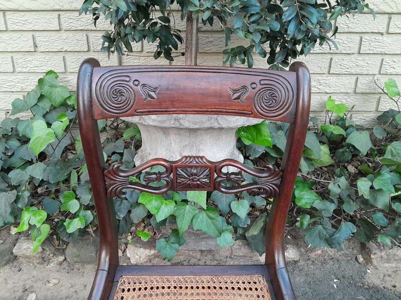 An Antique Regency Carved Rosewood Set Of Chairs With Rattan Seats And Upholstered Designer Fabri...