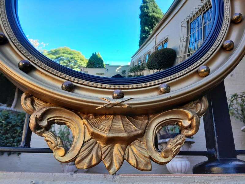 A 20th Century Regency / Federal Style Carved Eagle Mirror