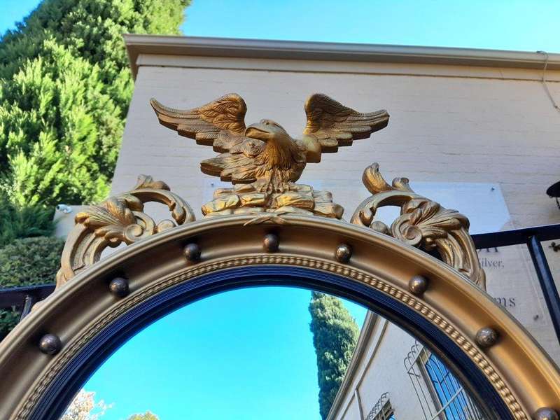 A 20th Century Regency / Federal Style Carved Eagle Mirror