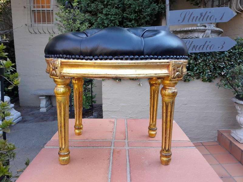 A 20th Century French-Style Beechwood Carved Footstool In A Hand Gilded Finish And Upholstered In...