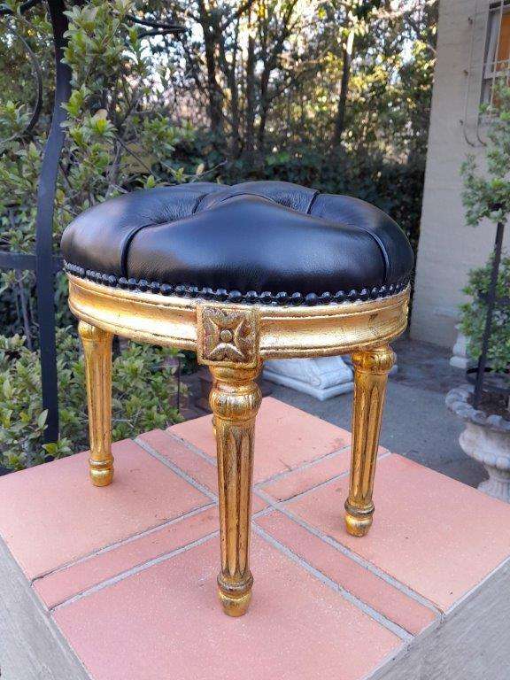 A 20th Century French-Style Beechwood Carved Footstool In A Hand Gilded Finish And Upholstered In...