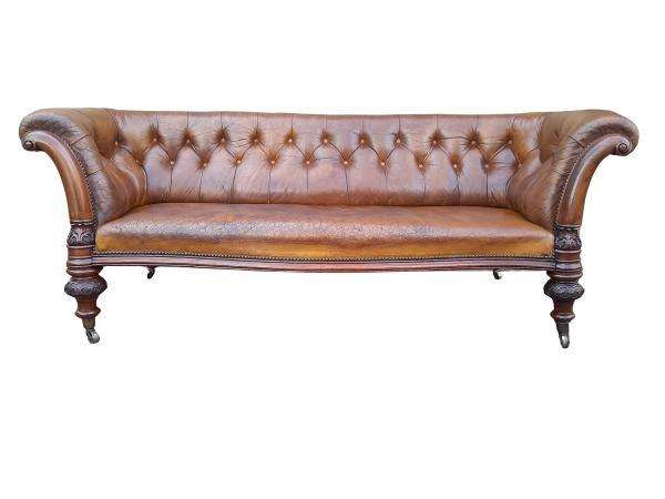 An Antique 19th Century Chesterfield Settee With Original Leather And Castors