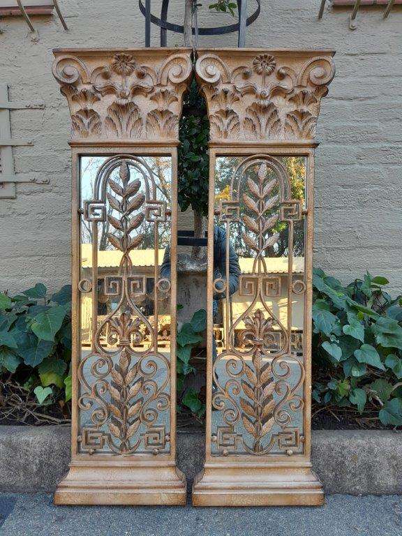 A 20th Century Pair Of Decorative Metal Plaque Style Mirrors