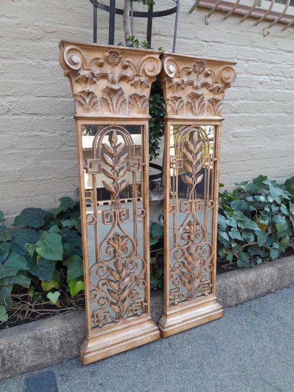 A 20th Century Pair Of Decorative Metal Plaque Style Mirrors