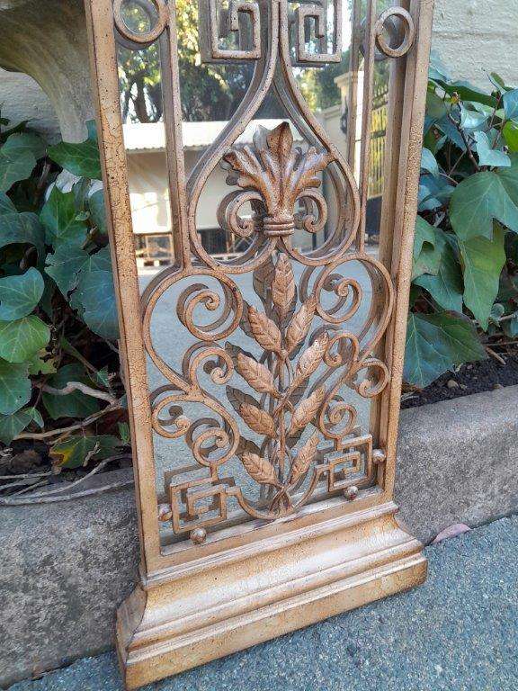 A 20th Century Pair Of Decorative Metal Plaque Style Mirrors