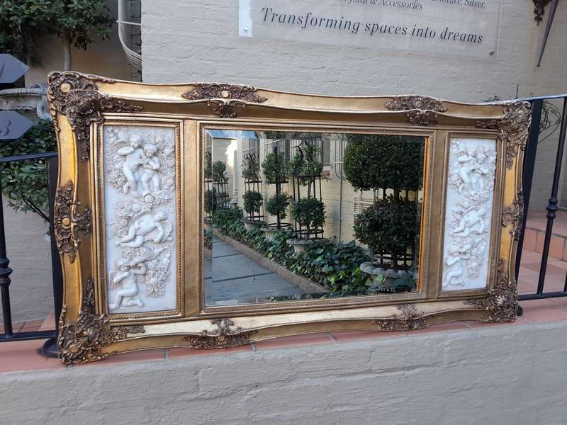 A 20th Century Carved And Gilded Bevelled Mirror With Marble Plaques