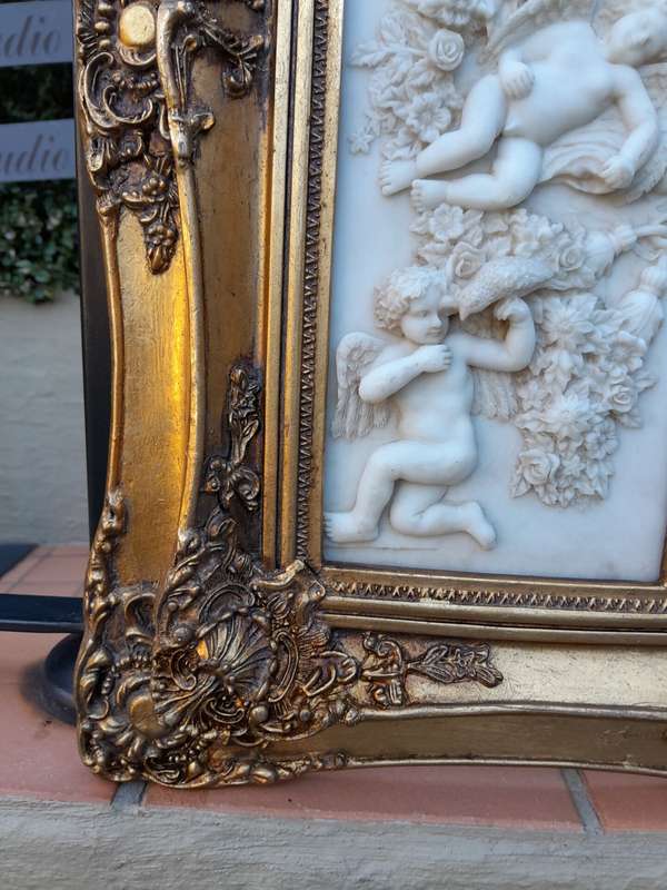A 20th Century Carved And Gilded Bevelled Mirror With Marble Plaques