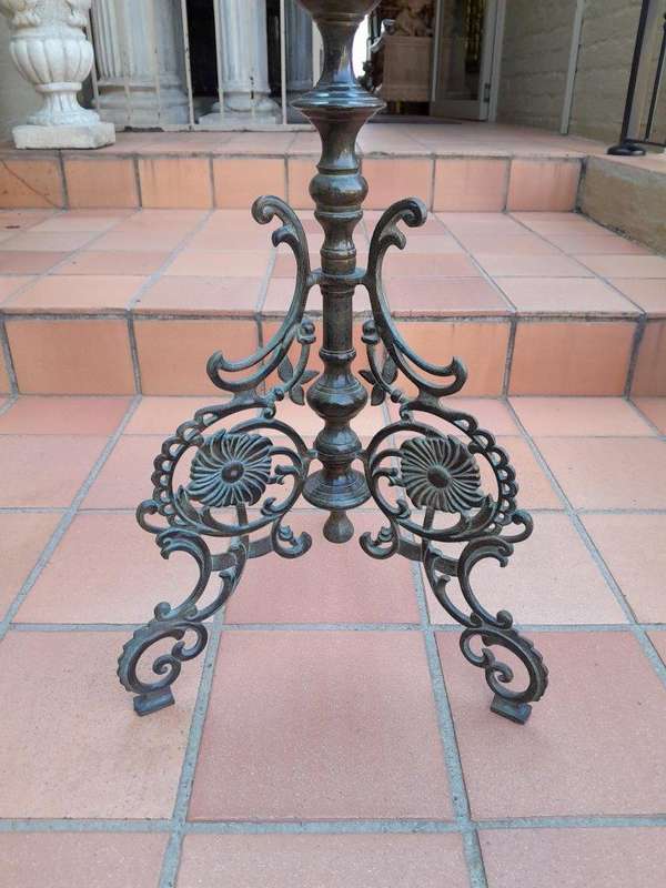 An Antique Victorian Ornate Wrought Iron Candle Holder