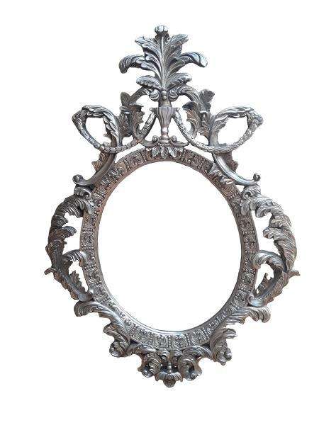 A French Style Ornately Carved And Bevelled Mirror In A Contemporary Silver Hand-Gilded Finish