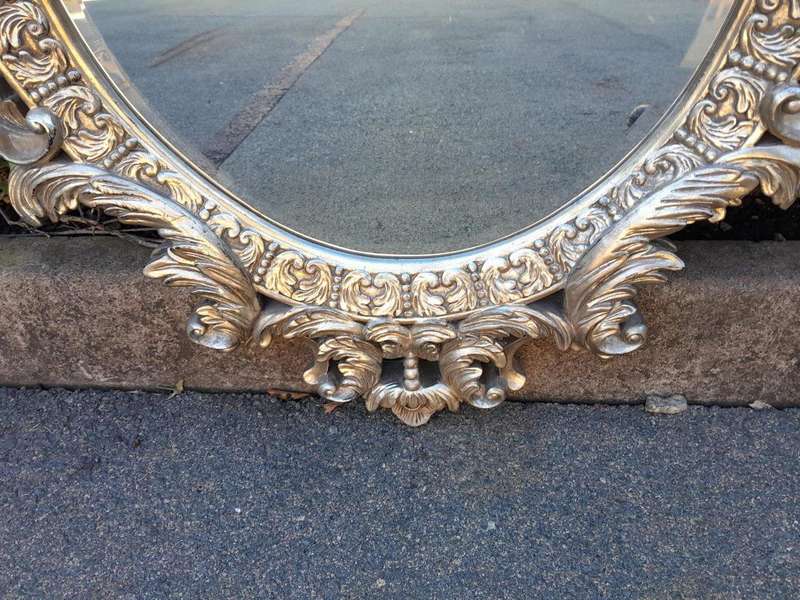 A French Style Ornately Carved And Bevelled Mirror In A Contemporary Silver Hand-Gilded Finish