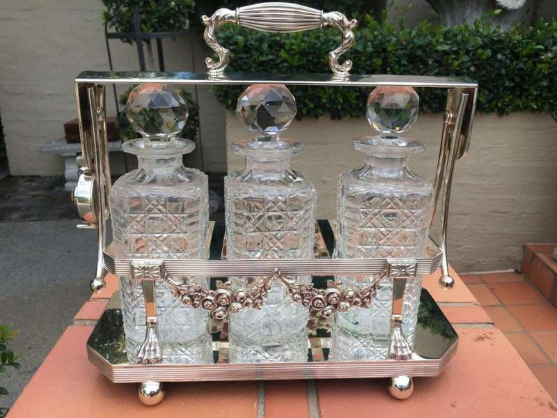 A Early 20th Century Edwardian Silver Plated Tantalus Circa 1901 To 1914 With Cut-Glass 3 Decanters