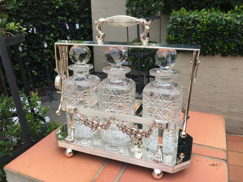 A Early 20th Century Edwardian Silver Plated Tantalus Circa 1901 To 1914 With Cut-Glass 3 Decanters